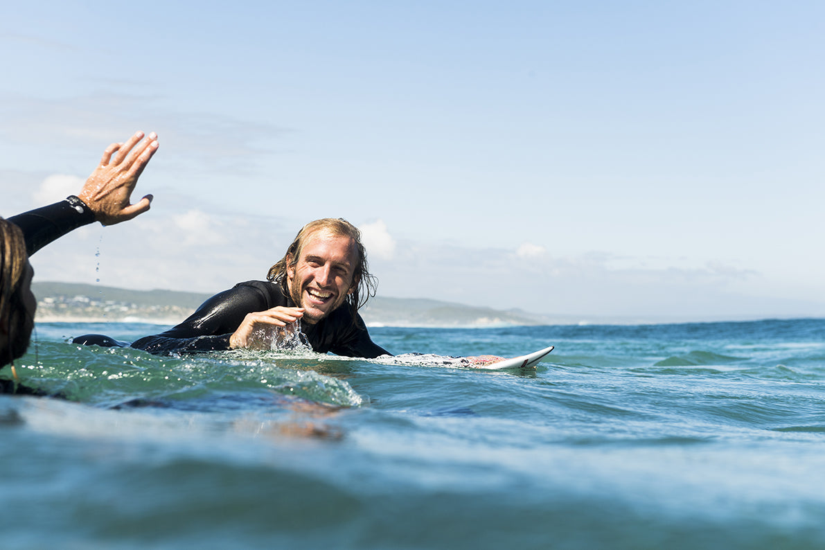 A man on a surfboard