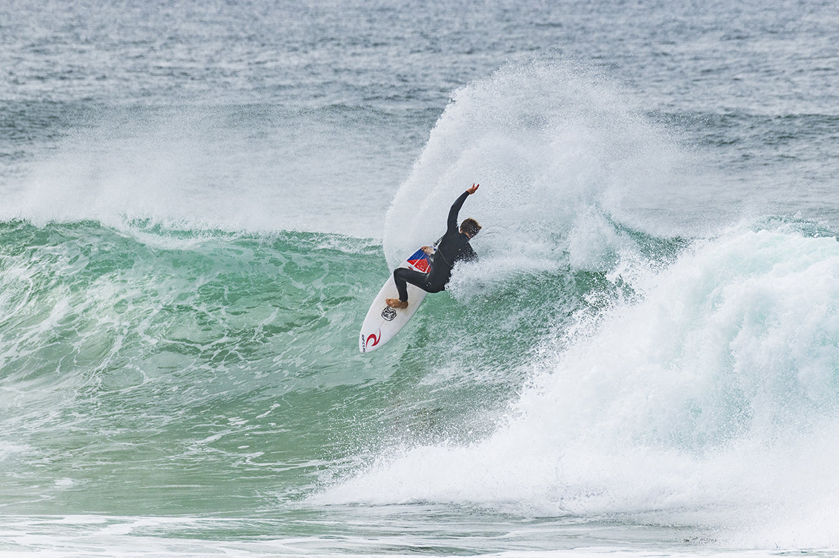 A surfer riding the waves
