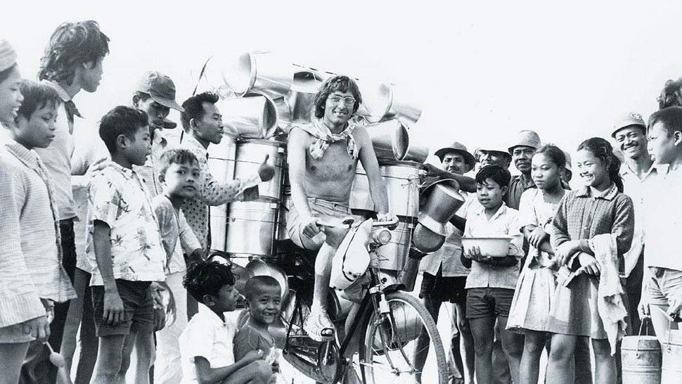 Crew in indonesia around a man on a bike