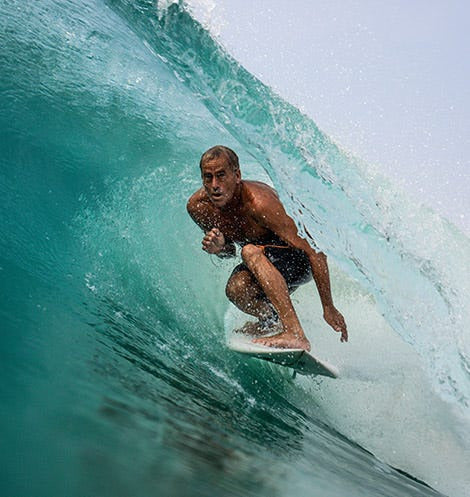 A surfer riding a barrel
