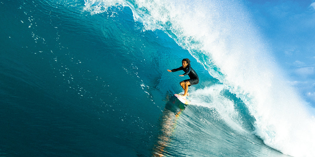 Mason Ho surfing in Hawaii